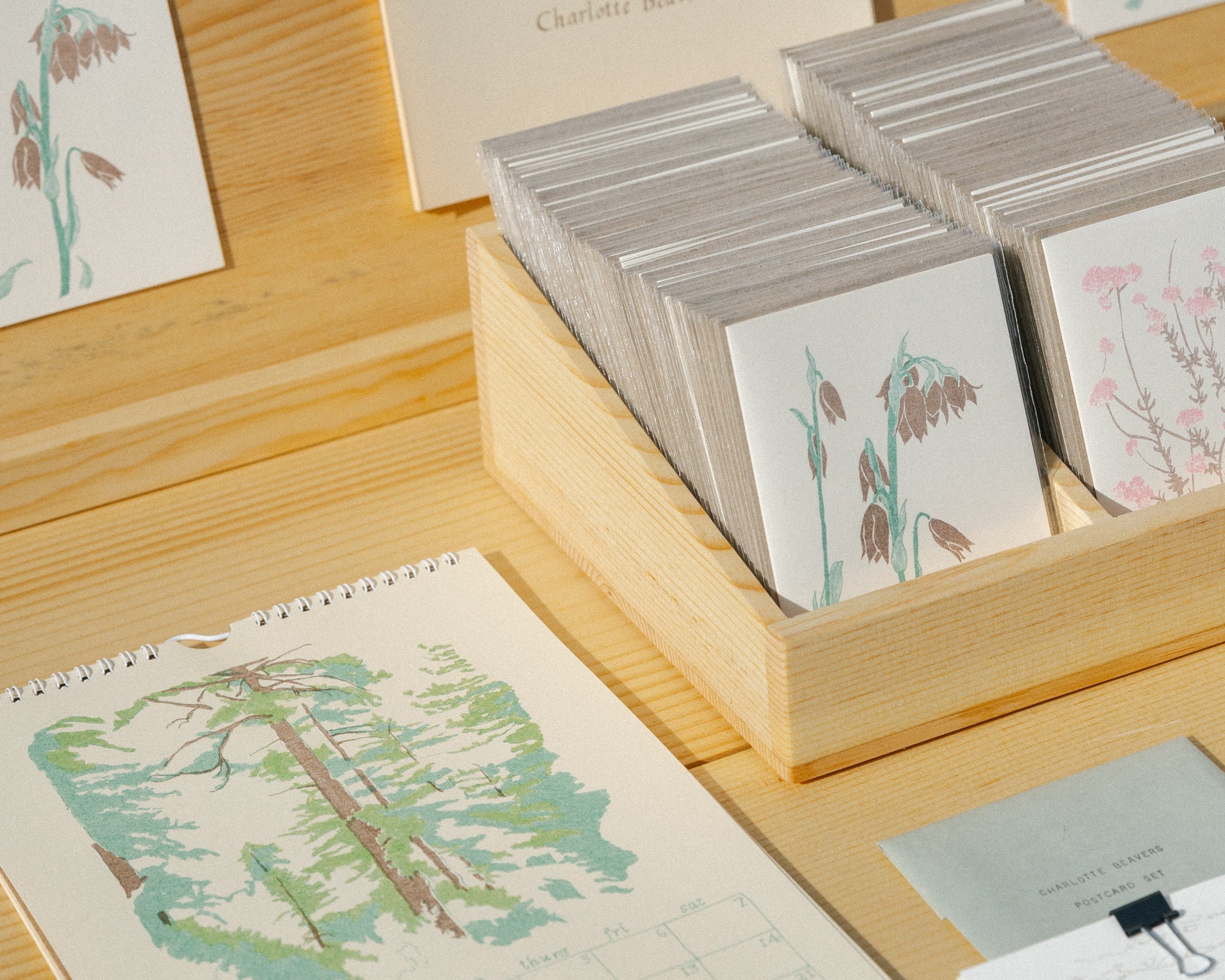 2020 calendar and card set on a wooden surface with nature-themed designs.