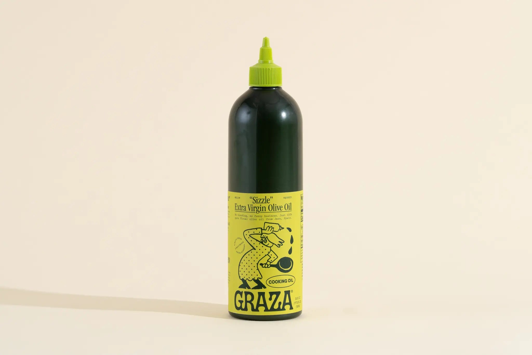dark green Graza olive oil bottle with yellow label shot by Connie Park